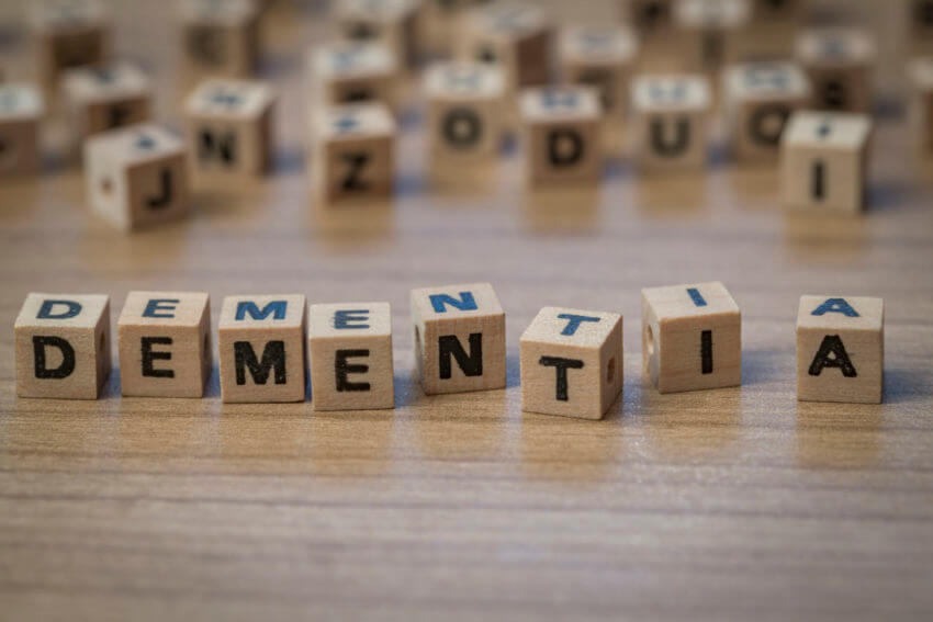 wooden blocks on a table spelling out the word Dementia