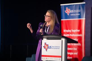 Dr. Jennifer Potter, PhD, speaking at a conference